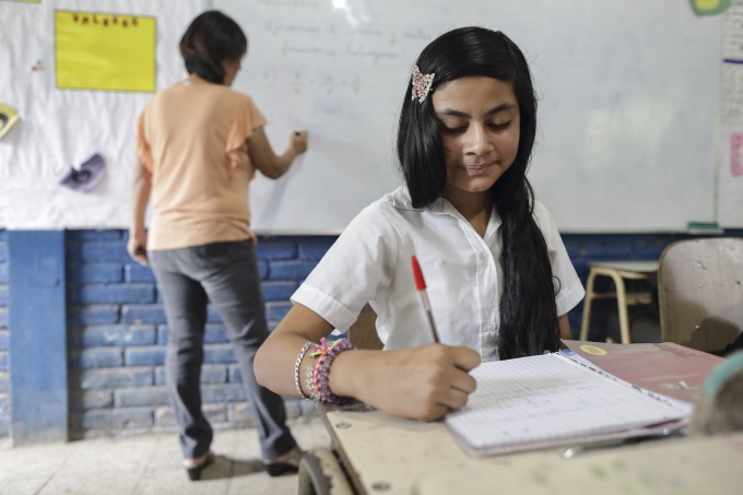 A young girl taking notes during a math lesson. El Salvador. Credit: World Bank
